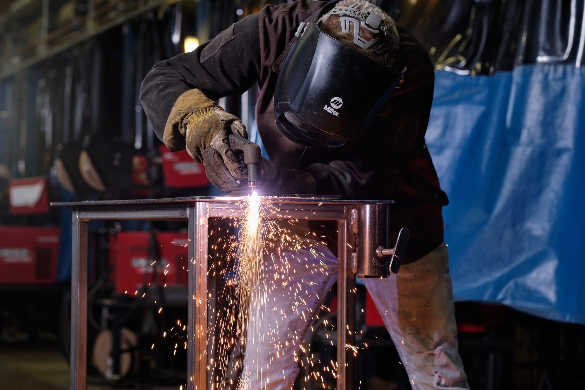 Student using plasma cutter
